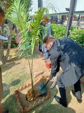 President Field plants a palm tree in the gardens of the office of the  Ombudsman Sindh.